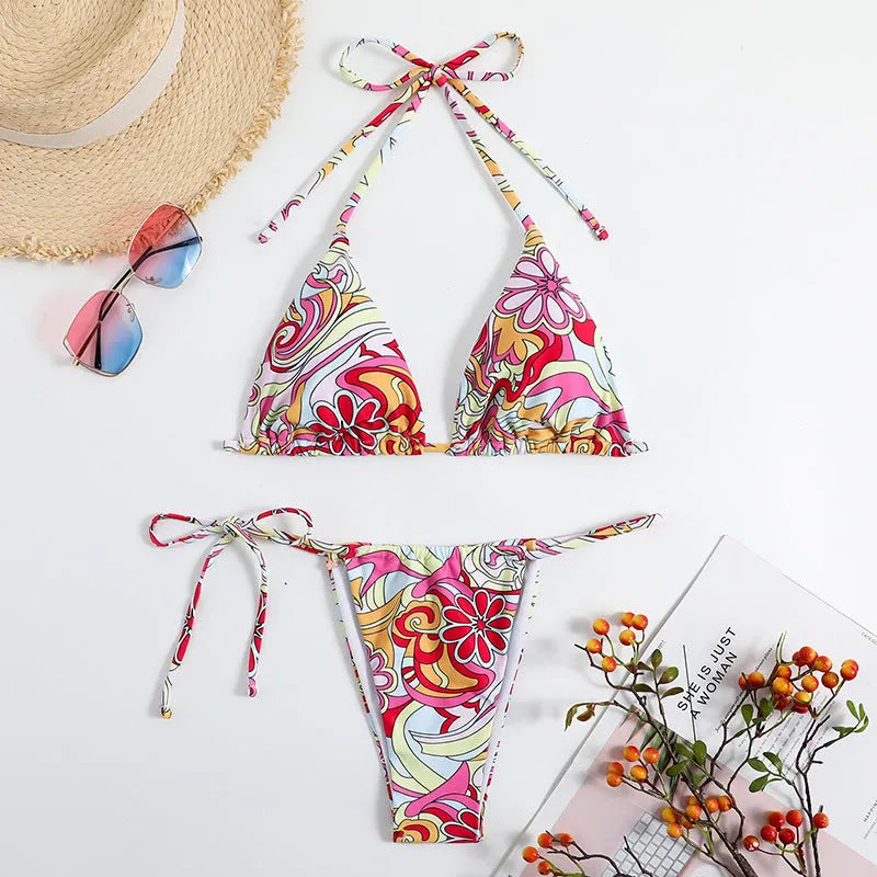 Women's multicolour printed triangle bikini top with hanging neck and matching briefs.