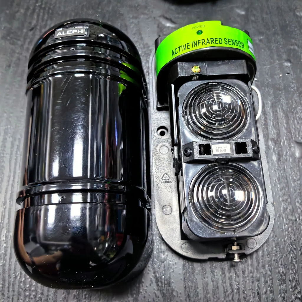 Black infrared anti-theft alarm detector with 150 metre range for warehouse security