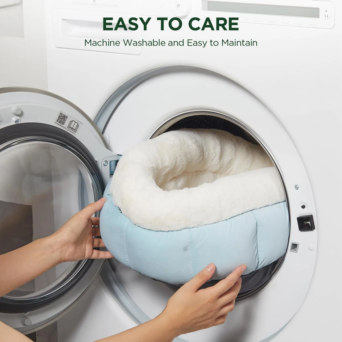 Round donut dog and cat bed in faux rabbit fur with anti-slip bottom and raised sides, available in five sizes