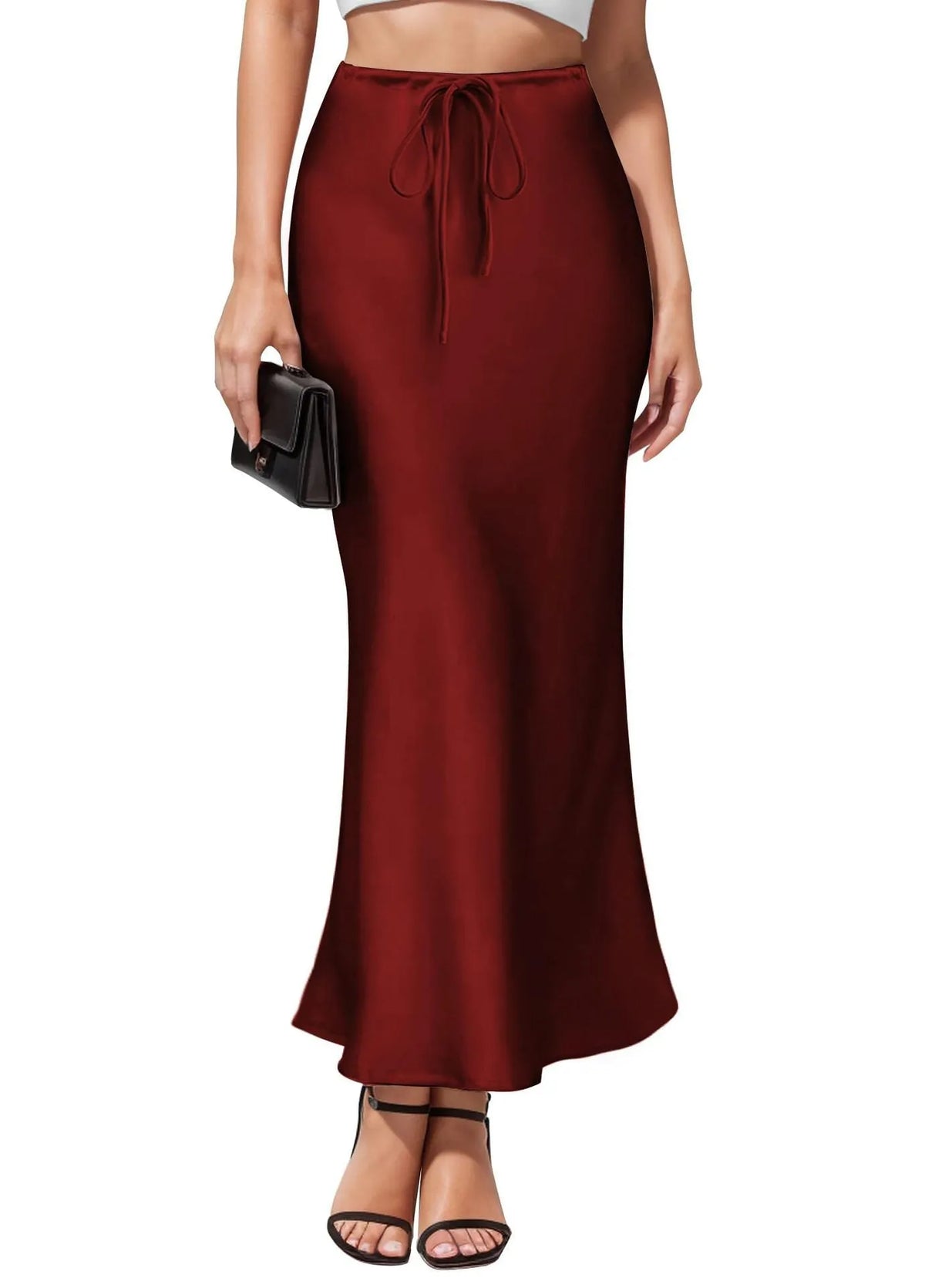 Women's high-waist asymmetric satin skirt in black with irregular stitching detail.