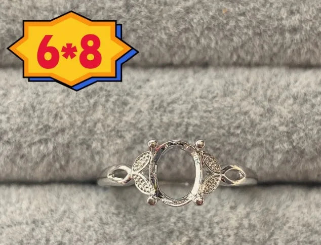 Oval denier ring with 6x8mm stone and five-pointed star element on copper band