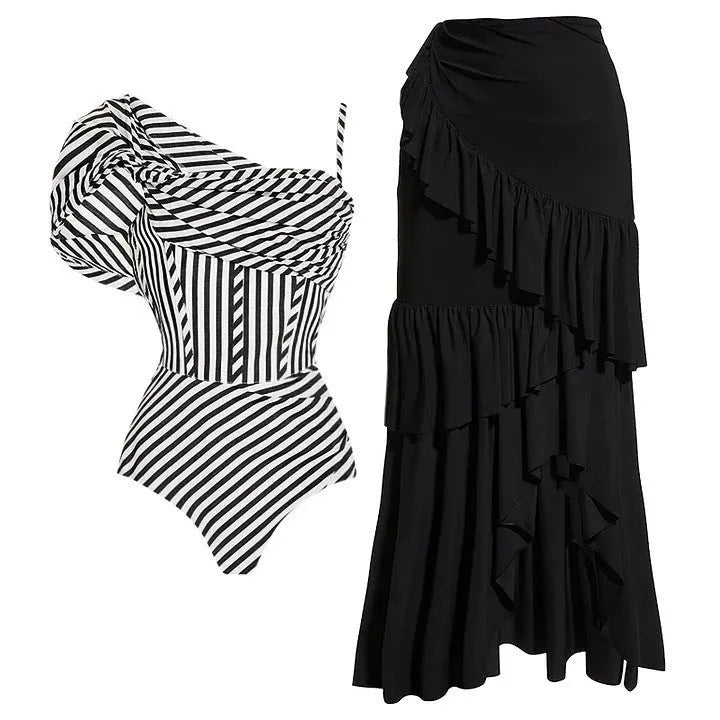 Women's striped one-piece swimsuit with black ruffle skirt detail for beach and pool wear