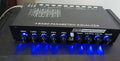 Black car audio EQ tuning amplifier with control panel for frequency and volume adjustment