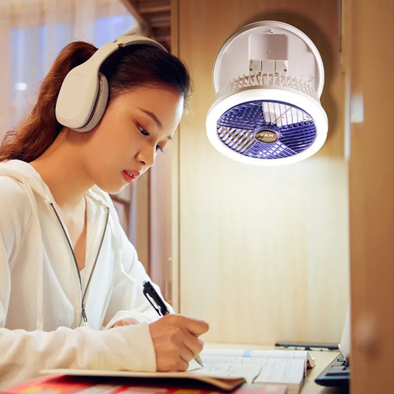 Blue foldable table fan with LED light showing 300° rotation angle and pen holder design