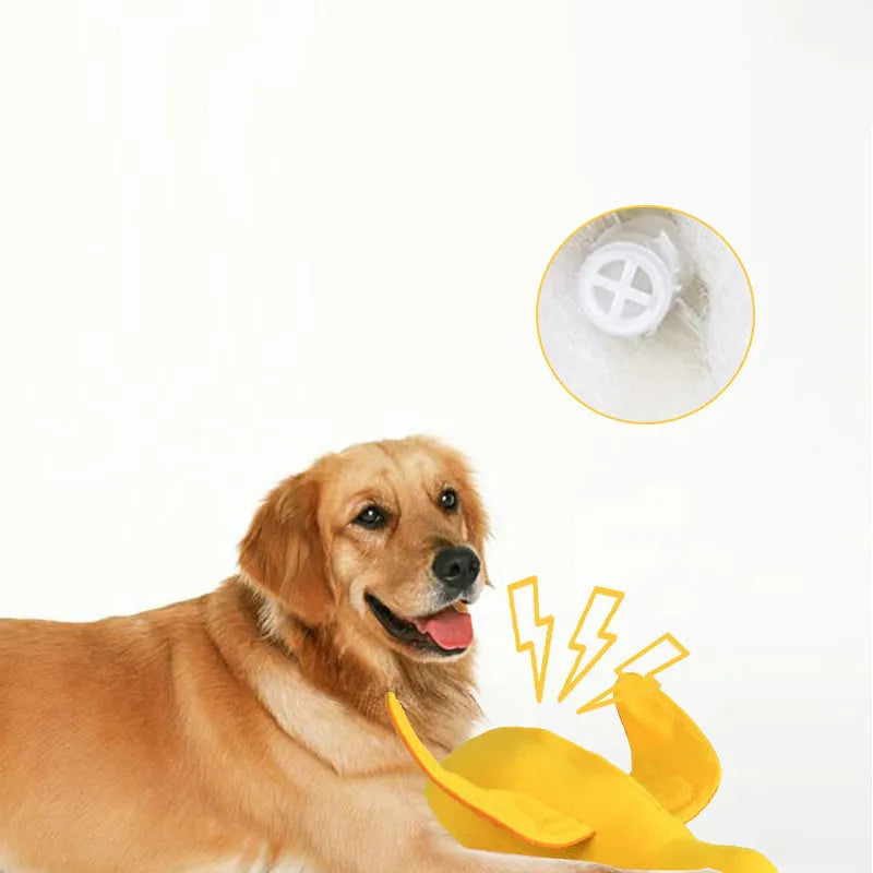 Yellow plush duck dog toy with squeaker and food leak compartment for treats.
