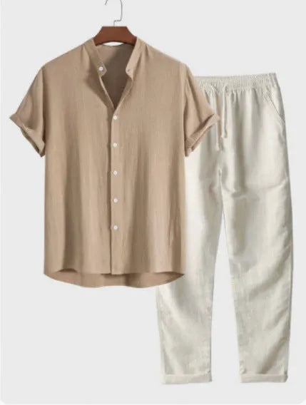 Man wearing a loose-fit short sleeve shirt and matching trousers from a casual linen-look two-piece set.