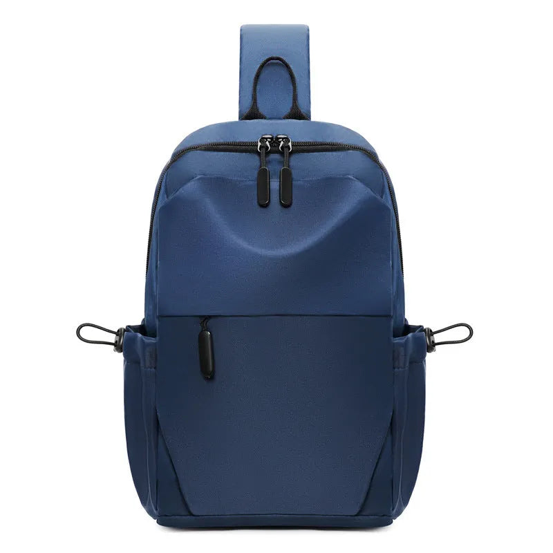 Men's grey waterproof large chest bag with shoulder strap, showing front pocket and main compartment.