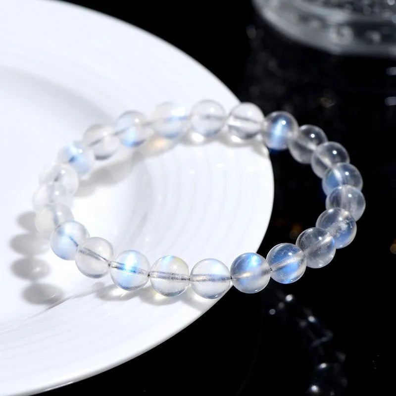Natural crystal blue moonlight bracelet with grinding treatment showing multiple diameter options on wrist
