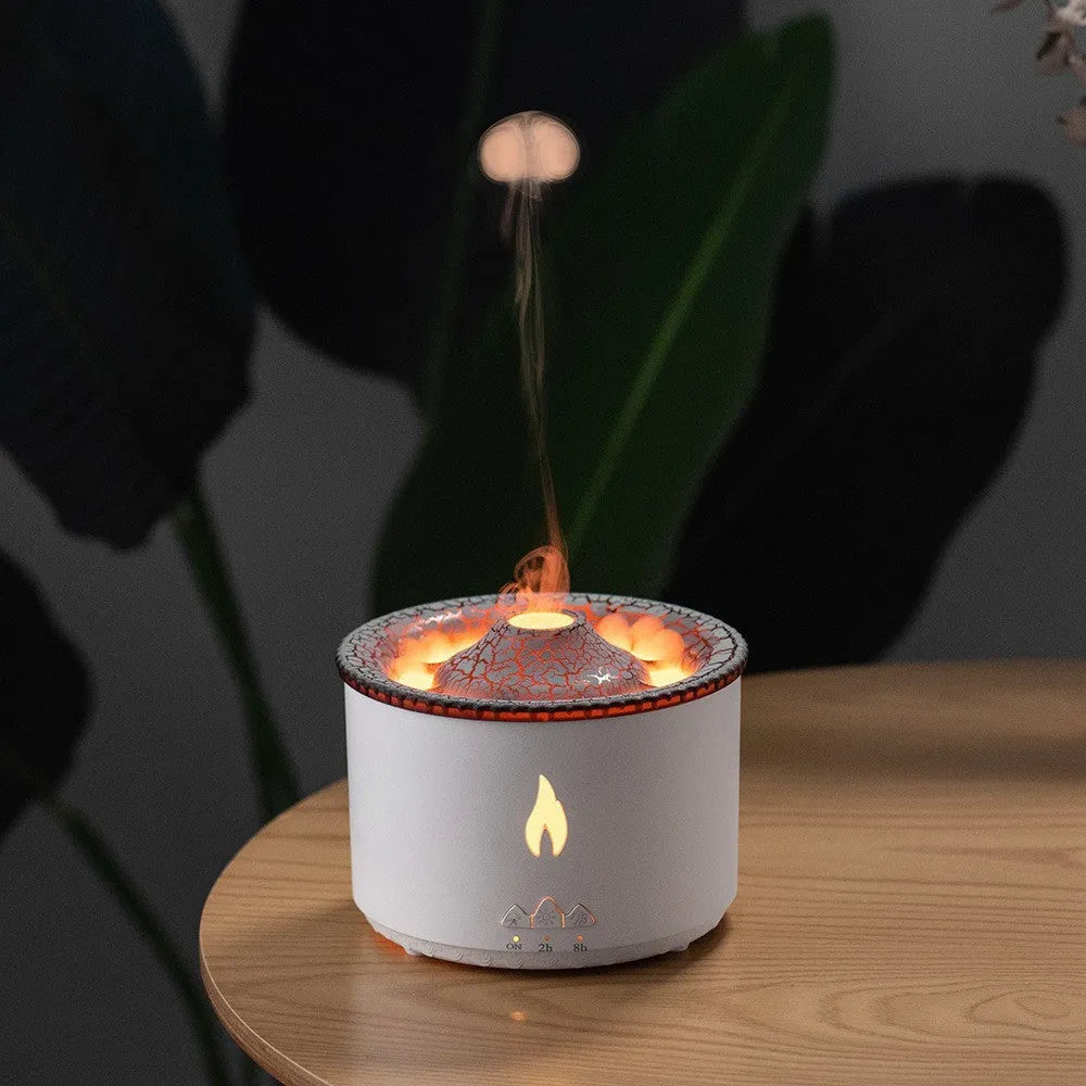 Volcano-shaped humidifier emitting a two-colour mist ring on a table.