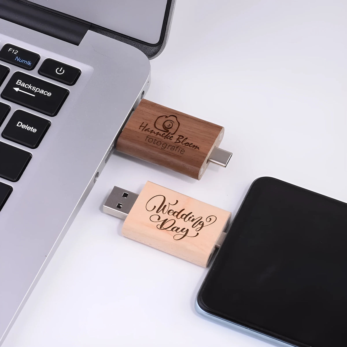 Maple wood USB flash drive with Type-C adapter for mobile phones on wooden surface.