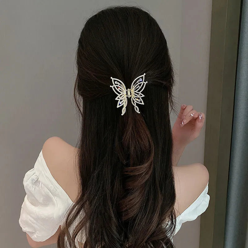 Alloy butterfly hair barrette clip with electroplated finish, shown in rhinestone and pearl style options