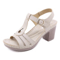 Women's patent leather thick heel sandals with a round toe and silver metal buckle closure.
