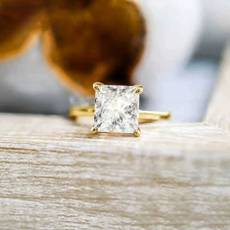 Geometric 925 sterling silver women's ring with round zirconia stone in silver, gold, and rose gold finishes.