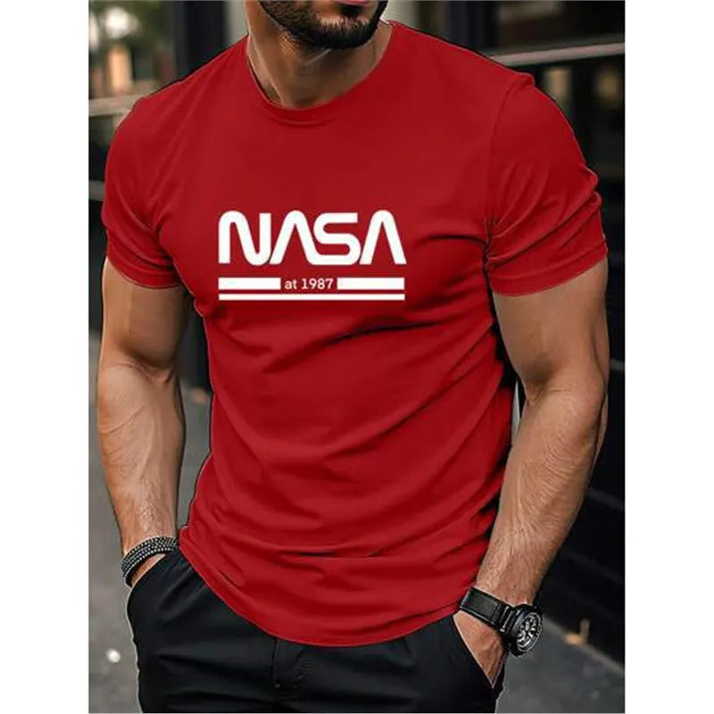 Man wearing a slim-fit apricot coloured cotton T-shirt with a printed letters design on the front.