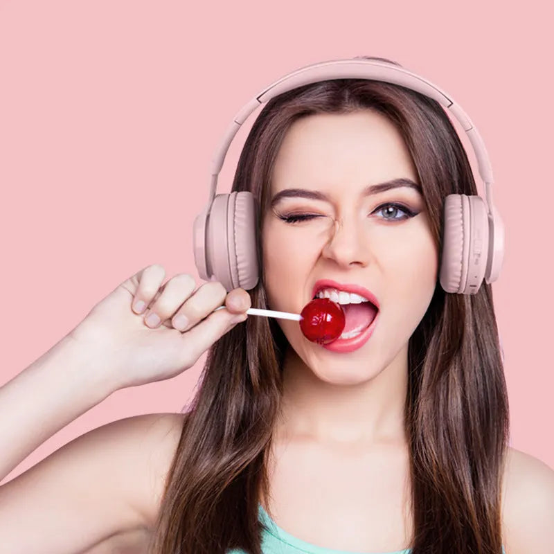 Children's wireless headphones with RGB LED lights in bunny pink colour showing Bluetooth connectivity
