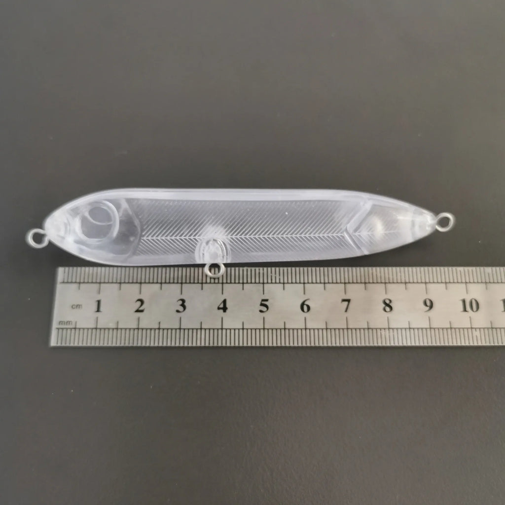 Clear plastic 9.5cm fishing bait blank body with a visible 7mm mounting hole