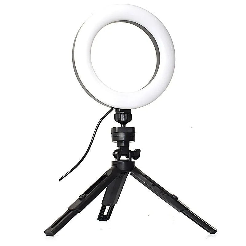 Black mobile phone video bracket with adjustable fill light mounted on a desktop tripod.