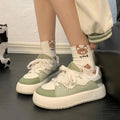 Green women's casual shoes with PU mesh upper, flat heel, and round toe on a plain background.