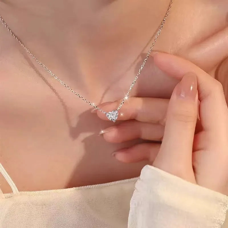 Women's silver heart necklace with copper construction and simple refined grace design