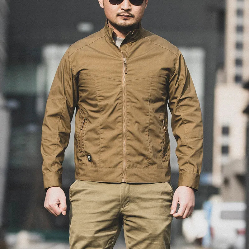 Men's brown camouflage military-style jacket with multiple pockets on a mannequin.