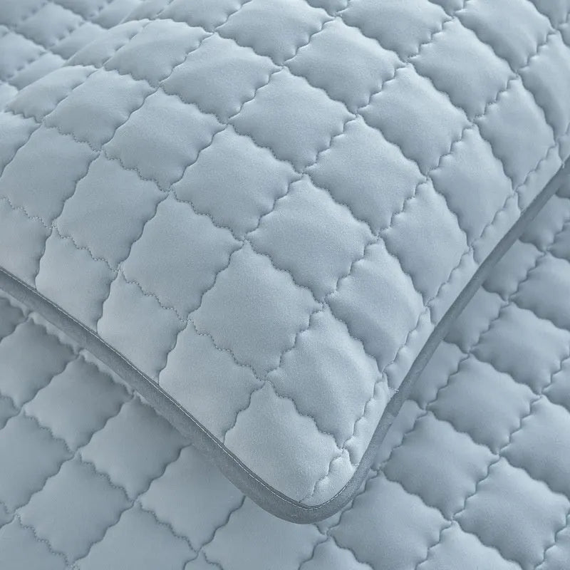 Class A waterproof fitted sheet in washed cotton, shown in light grey colour on a child's mattress.