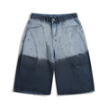 Blue gradient tie-dye loose cropped jeans on a mid-rise model.