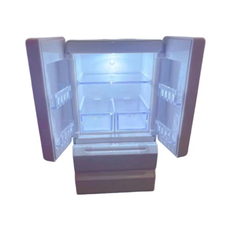 White plastic miniature candy toy model with lights on, showing detailed scene.