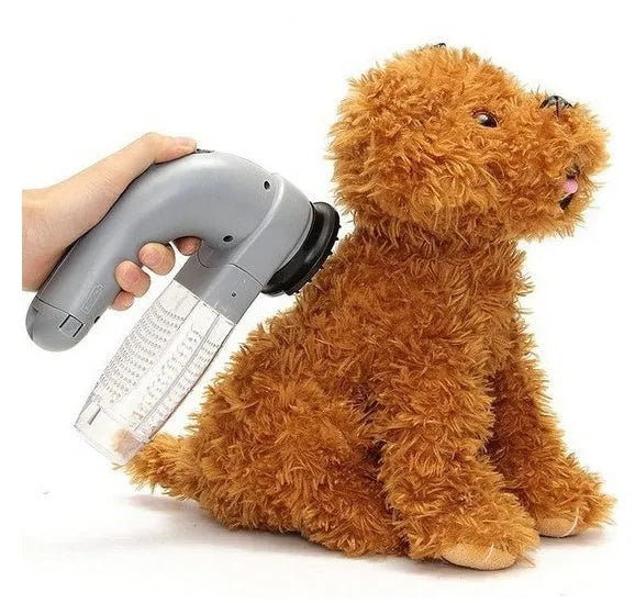 Grey portable electric pet hair vacuum cleaner with grooming brush.