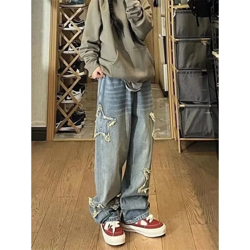 Blue high-waisted wide-leg denim jeans with a straight-leg cut on a model