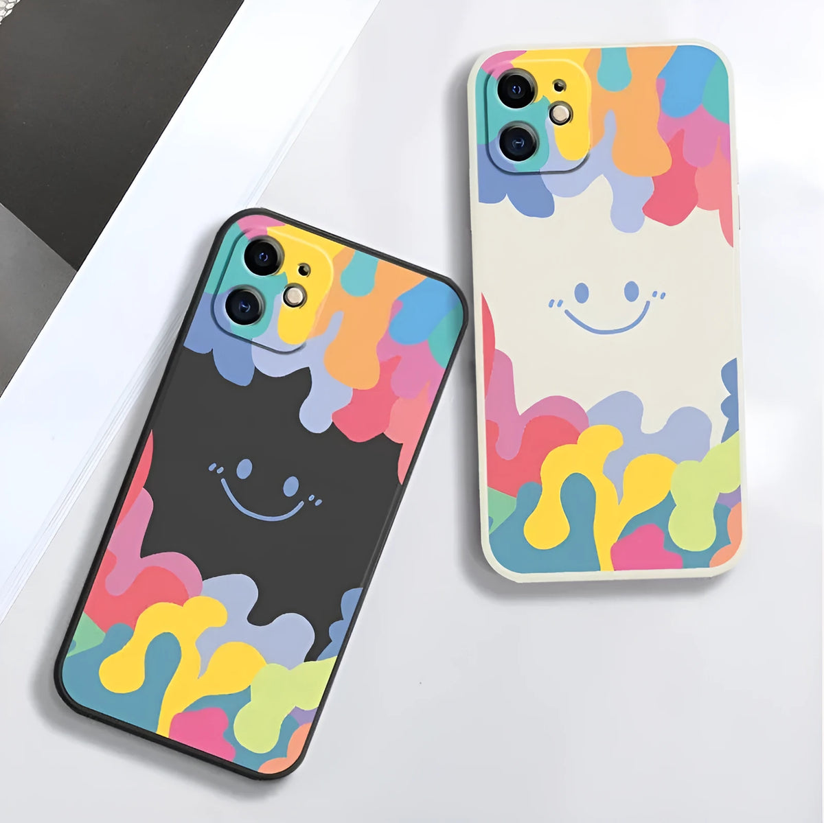 Colourful rainbow smiley face design on white TPU iPhone case with attached lanyard