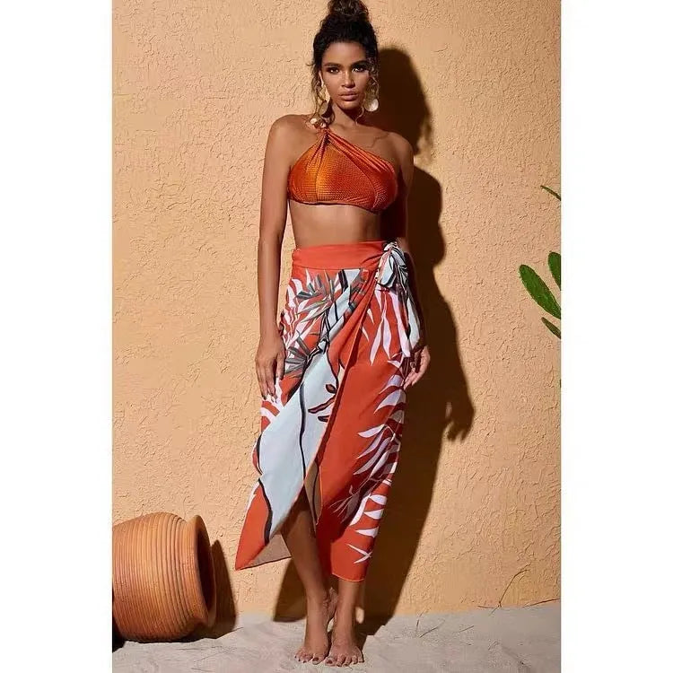 Brown women's high-waisted swimsuit with push-up top and a sheer black chiffon dress overlay.