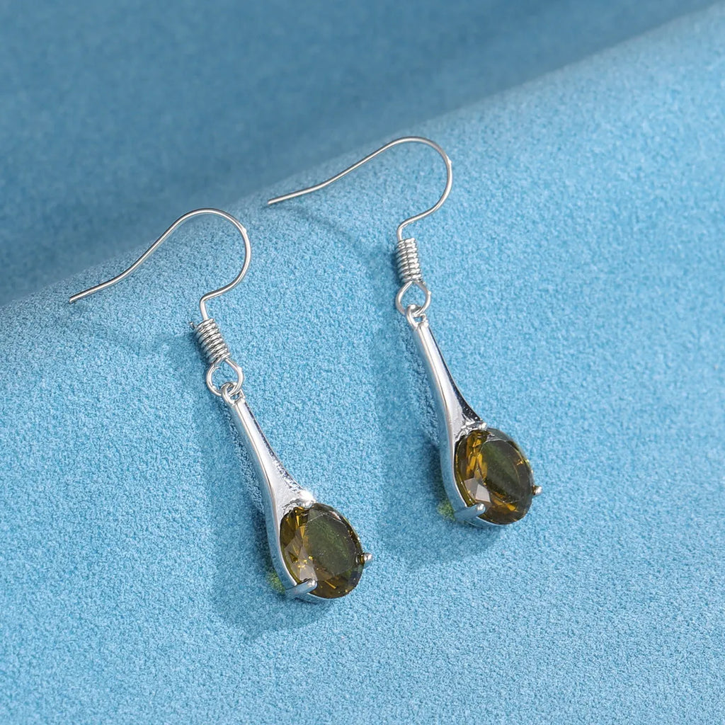 Olive green topaz earrings with water drop shape and retro design on alloy background