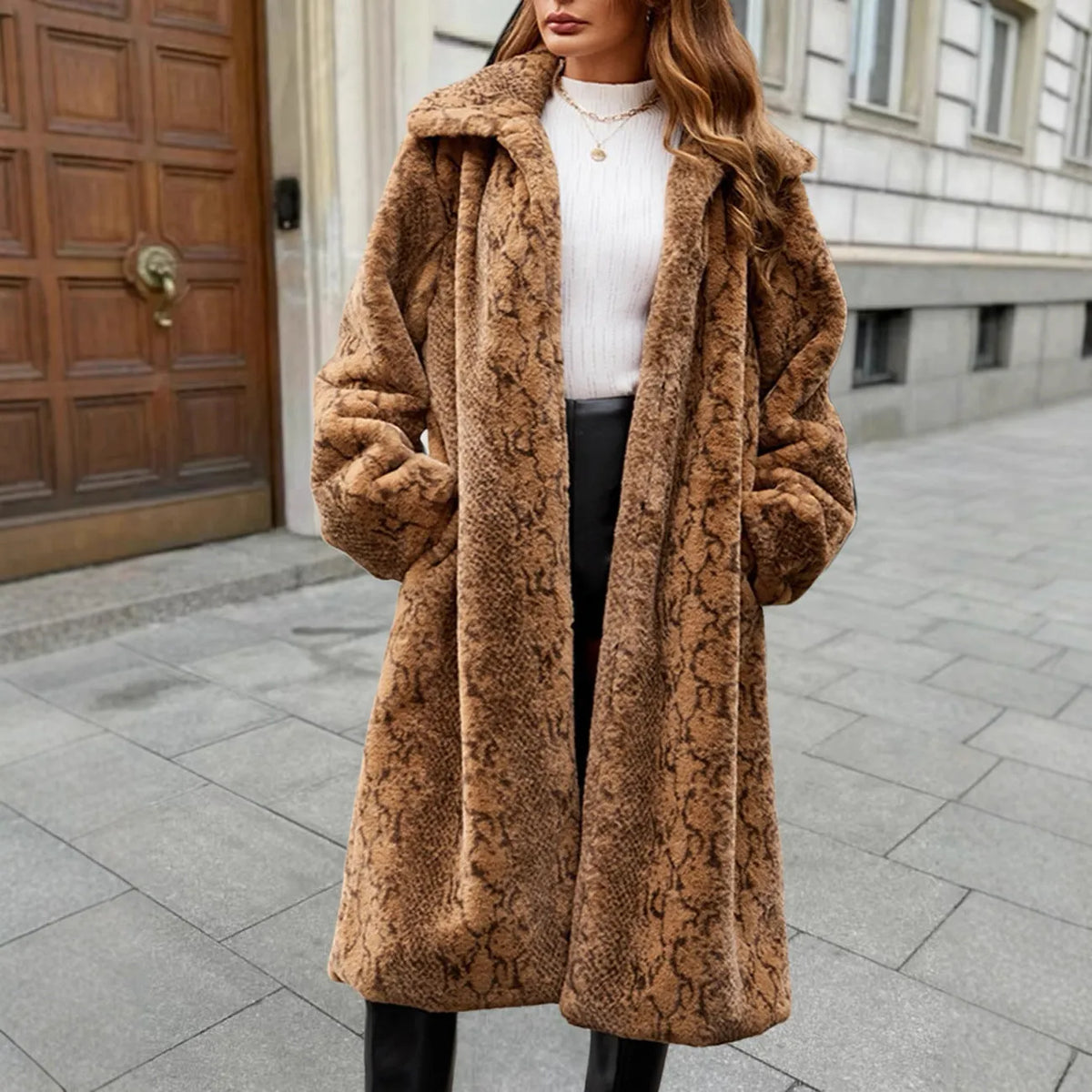 Women's long faux fur coat in leopard print, showing over-the-knee length and regular sleeves.