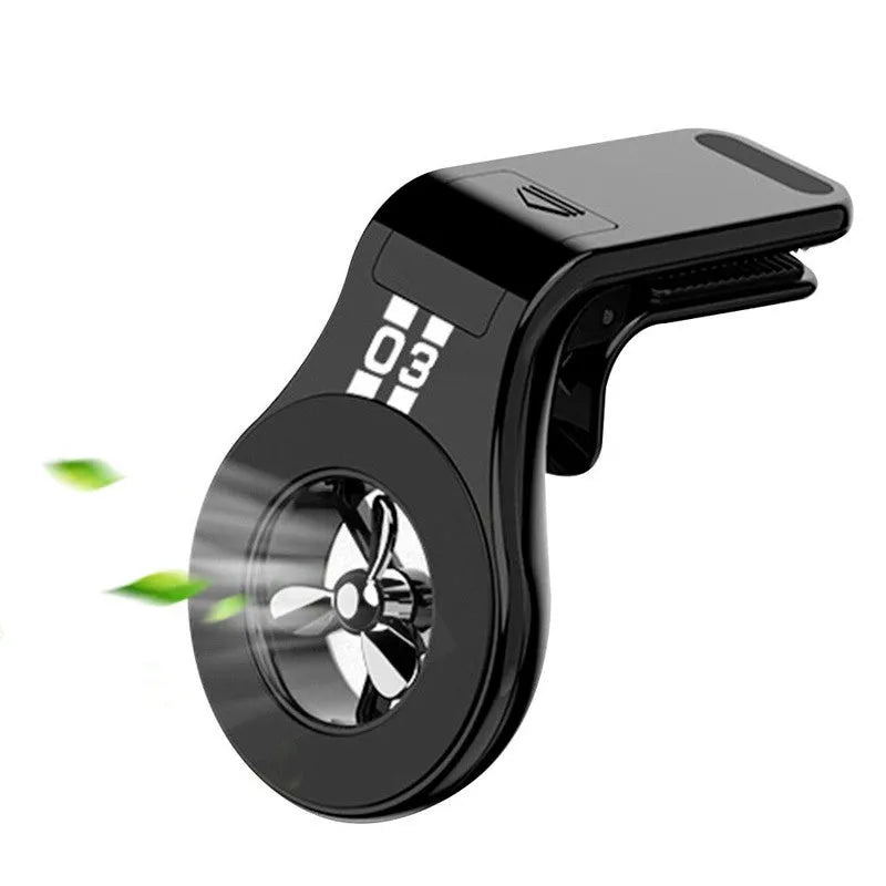 Black magnetic car phone holder with fragrance slice mounted on a car air vent
