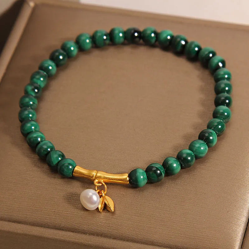 Women's white crystal bamboo bracelet showing adjustable design with bead arrangement
