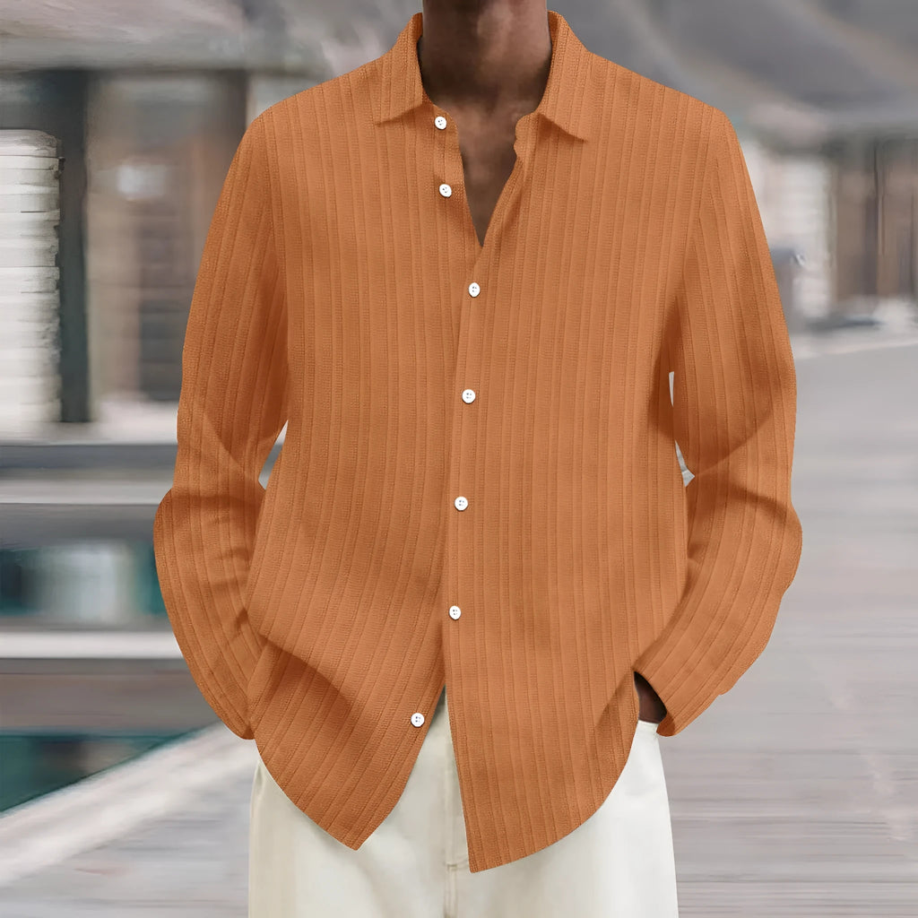 Man wearing a British-style striped cardigan with long sleeves and a loose fit