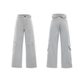 Men's dark blue loose straight-leg jeans with 3D cutting, heavy belt stitching, and pocket tassel details.