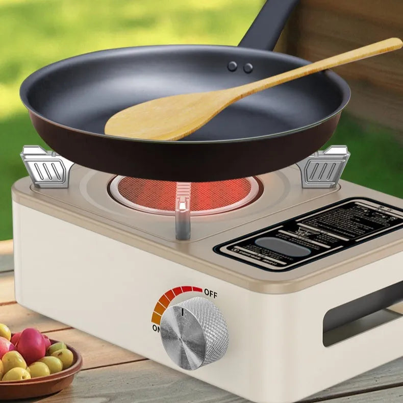 White portable stainless steel infrared gas stove for outdoor windproof cooking.