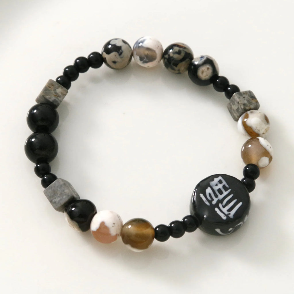 Hand-woven unisex bracelet with natural glitter stone, black agate, ceramic and round geometric beads