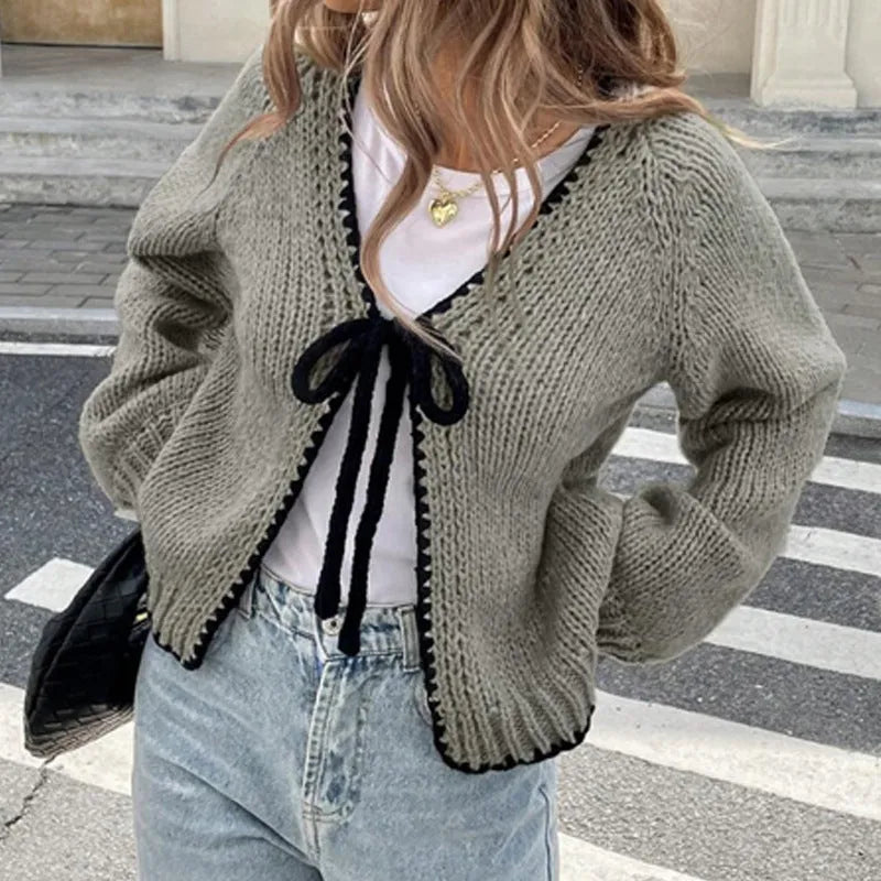 Women's grey lace-up cardigan sweater with crochet flower detail on front