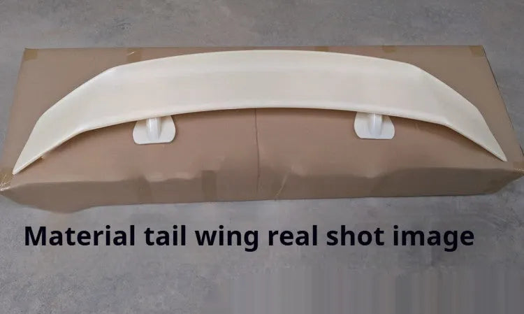 Universal fit car tail wing spoiler with punch-free mounting in carbon pattern finish.