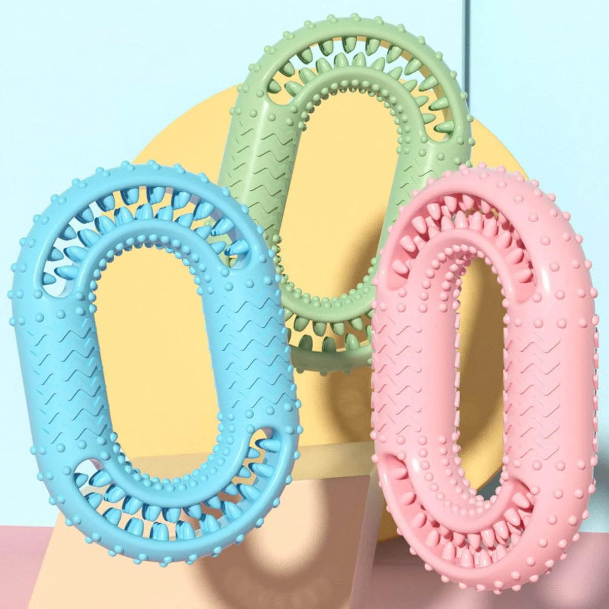 Blue green pink O-ring shaped dog chew toy for aggressive chewers measuring 12.5 by 8.6 centimetres