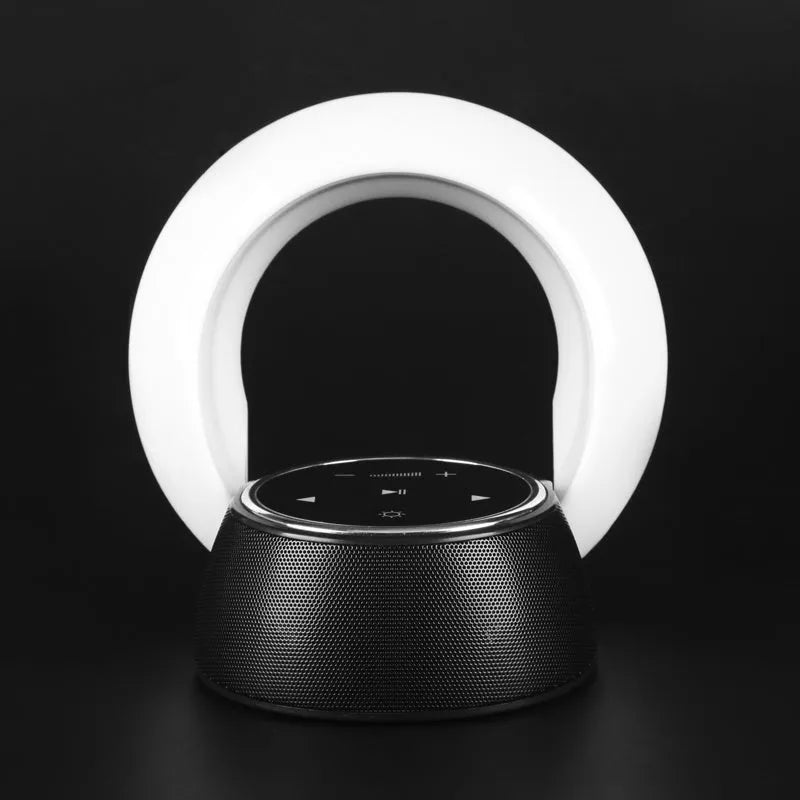 Blue Bluetooth speaker desk lamp with LED light and touch controls on wooden desk