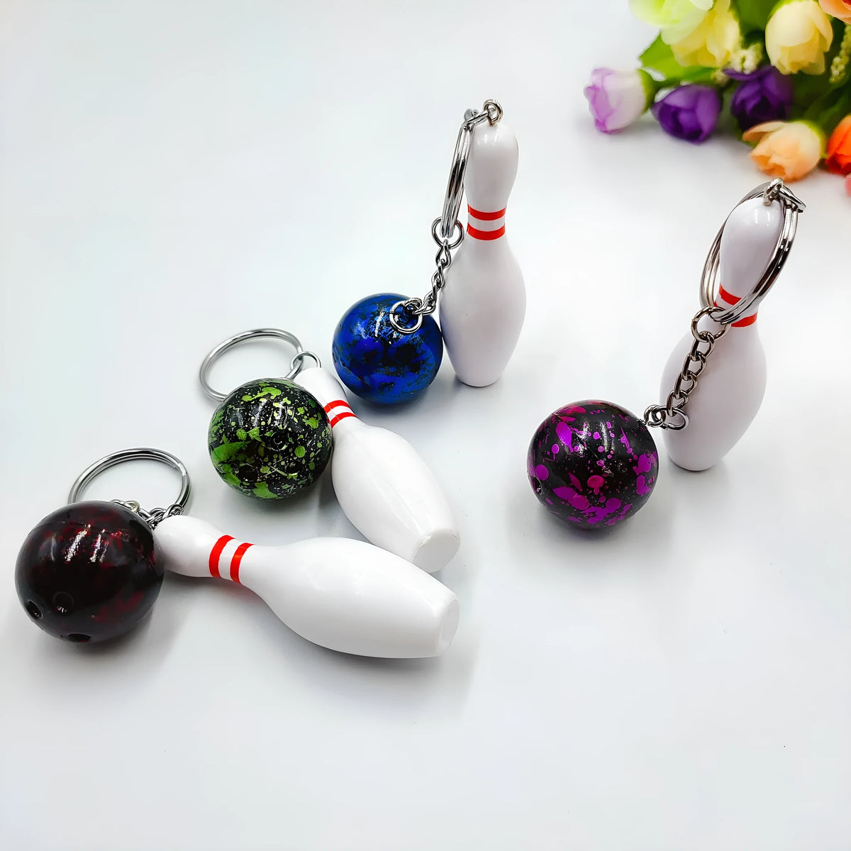 Mini simulation bowling keychain pendant in PVC metal showing four colour options