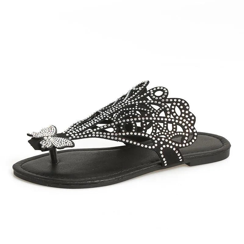 Women's gold slip-on sandals with rhinestone decoration and open flip-toe design.