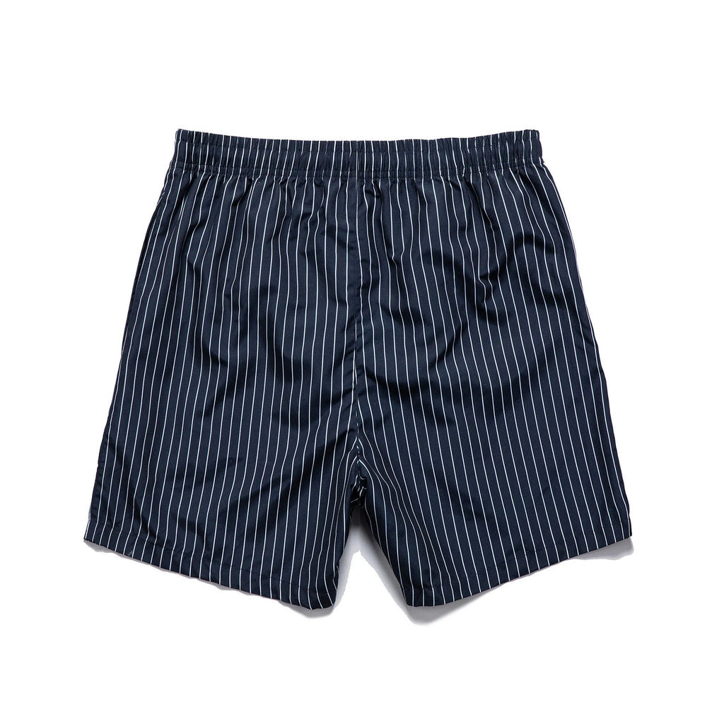 Navy blue striped beach shorts with straight leg opening and triangle lining, flat lay.