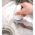 Orange and white carrot-shaped nylon cleaning brush with bristles, 20cm long