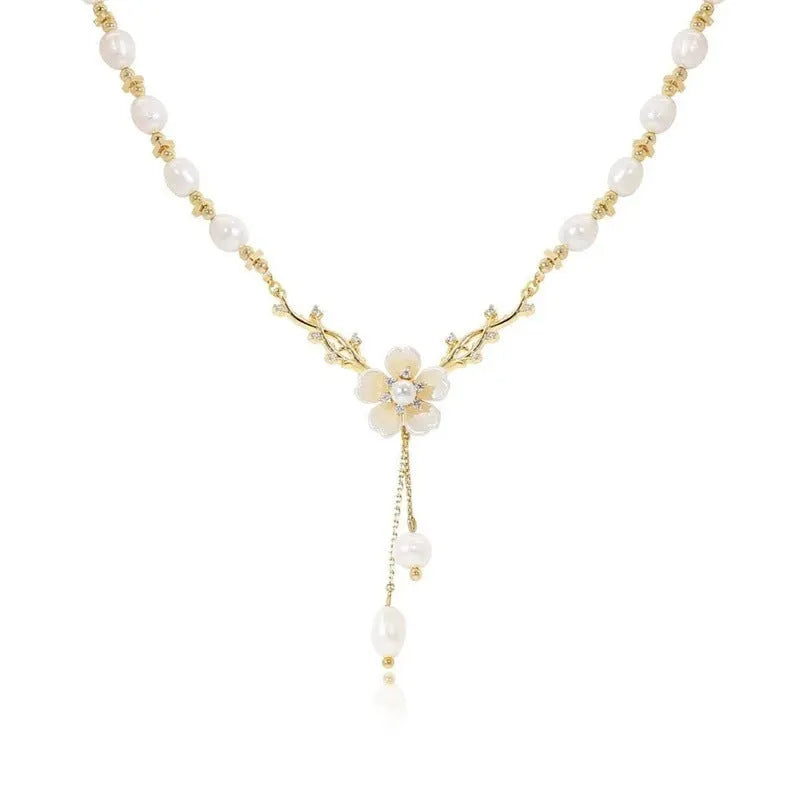 Alloy fashion necklace with pearl flower pendant featuring rose detailing in pearl flower colour