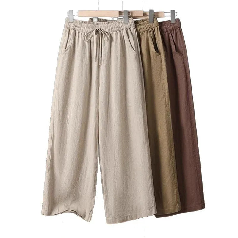 Women's straight-leg casual trousers with elastic waistband and lace-up drawstring detail in four colour options
