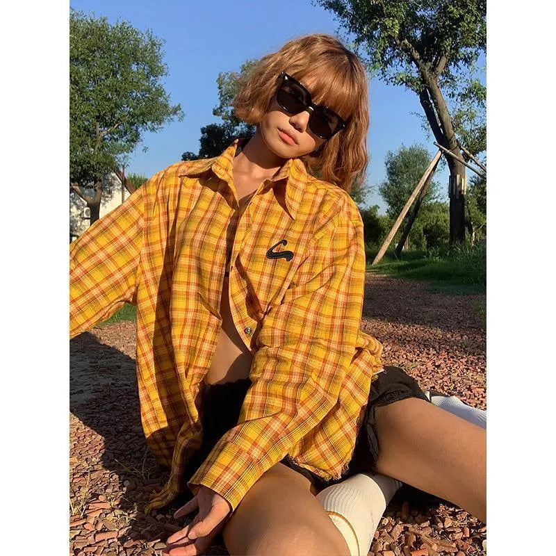 Dopamine yellow plaid loose fit shirt on hanger showing cardigan style and chemical fibre blend fabric